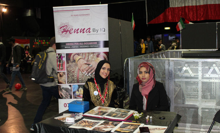 Henna By IQ at an event with guests nearby