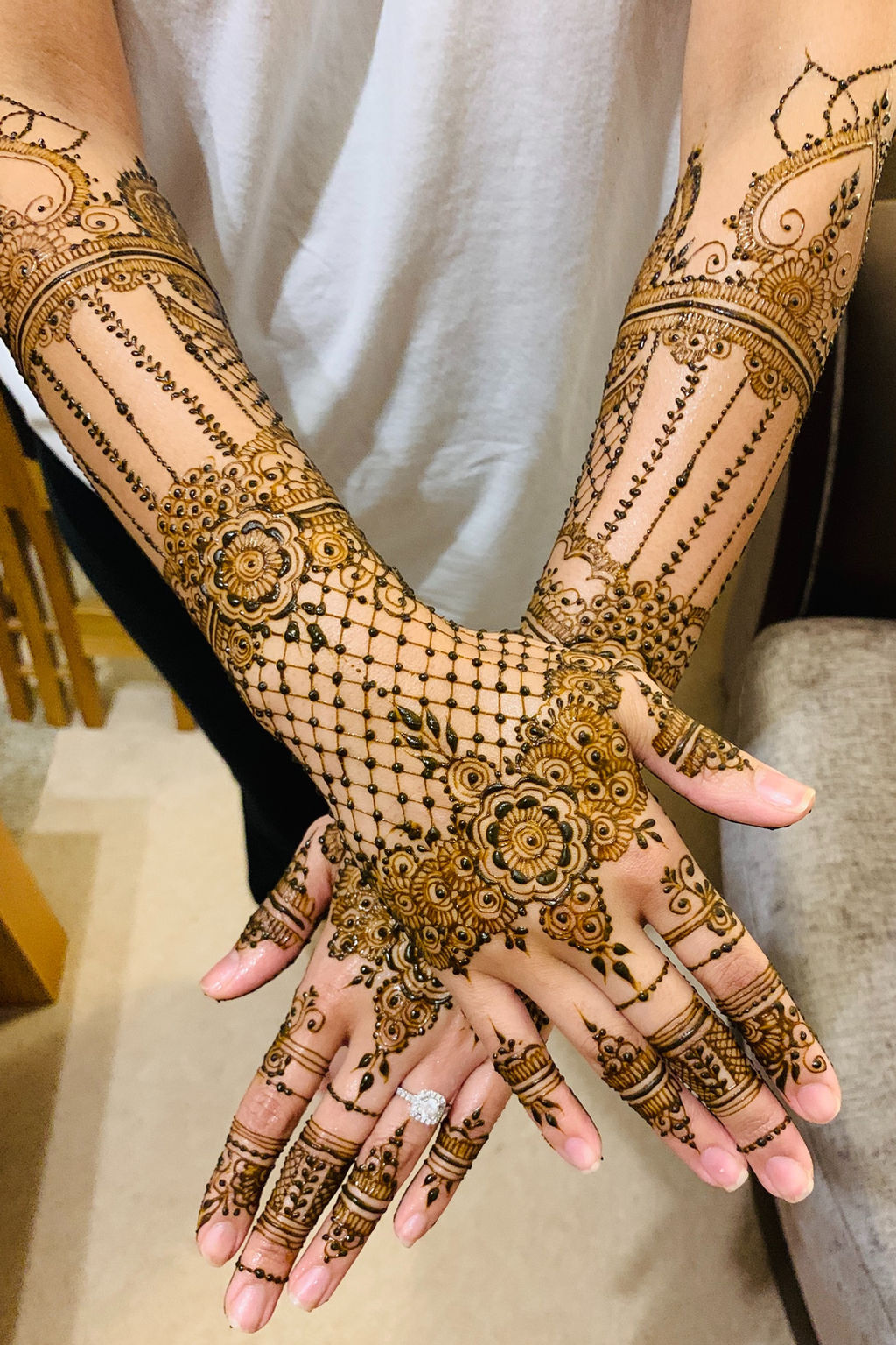 Close-up bridal hands with detailed Henna By IQ mehndi