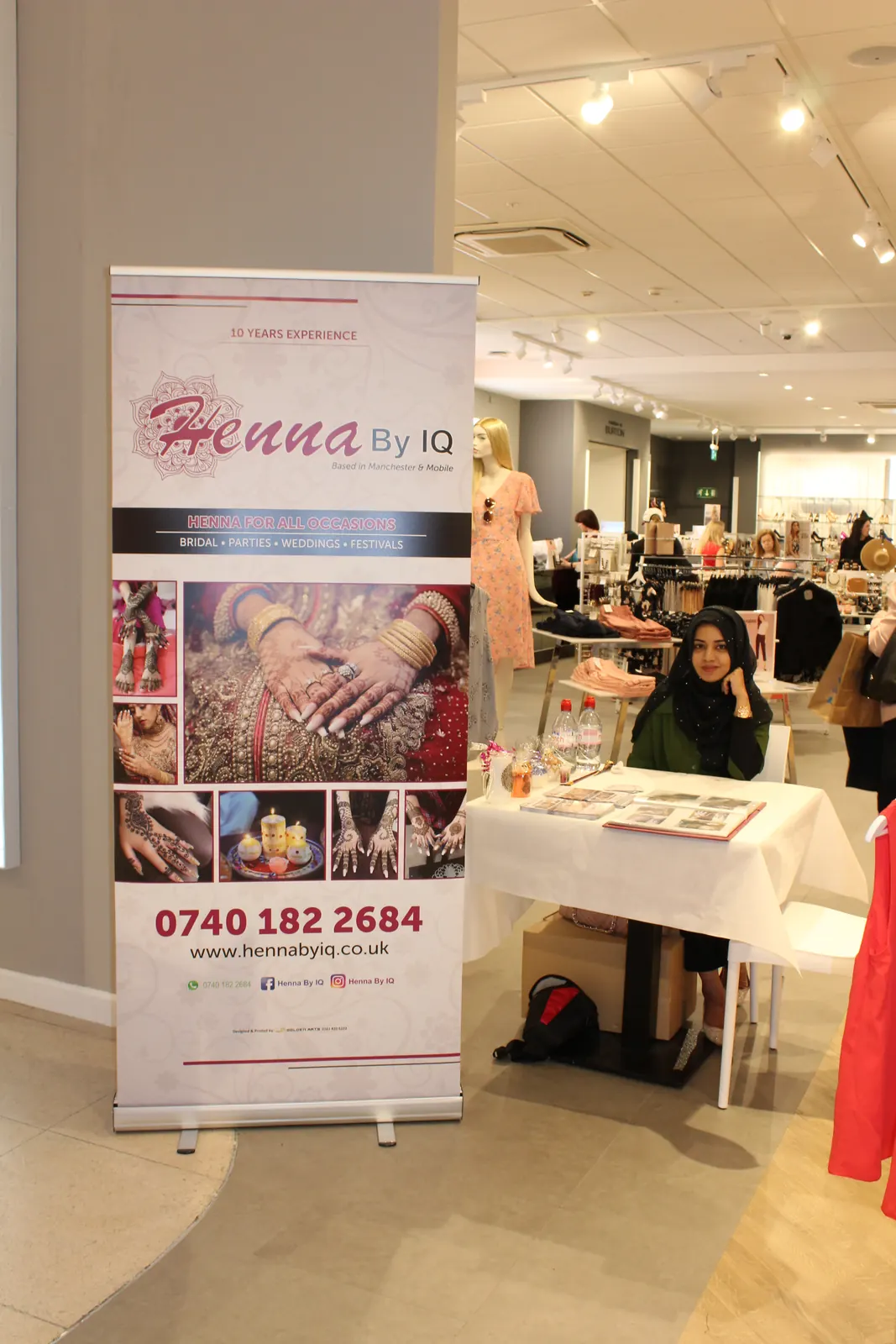 Henna artist at store event
